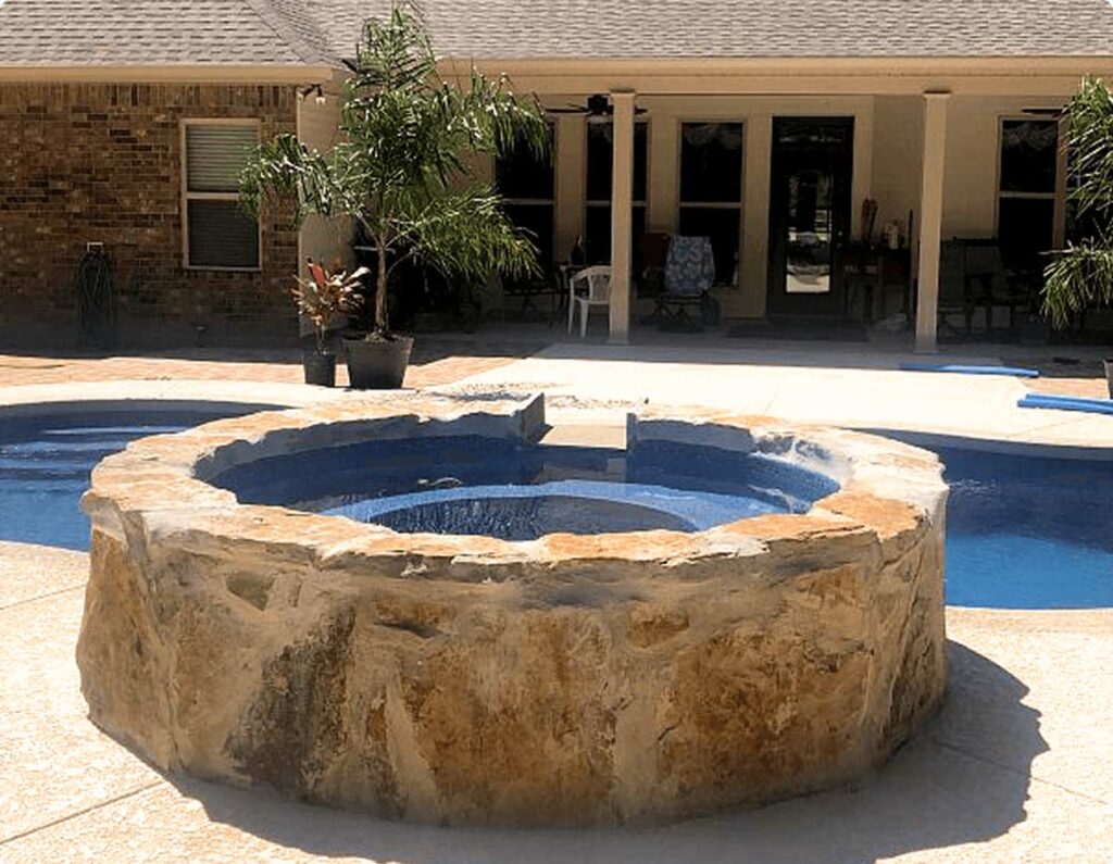 05_t_product-overview_spas_shasta-spillover_03cancun-pacific-blue-fiberglass-elevated-rock-spa.jpeg_2x