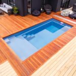 Small backyard with wood decking and plunge pool